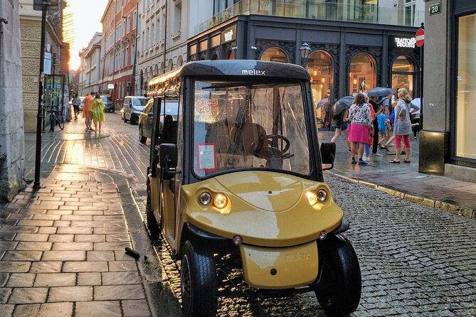1-Hour Tour to Krakow's Old Town by Electric Golf Cart - Reading the Main Market Square from a moving seat