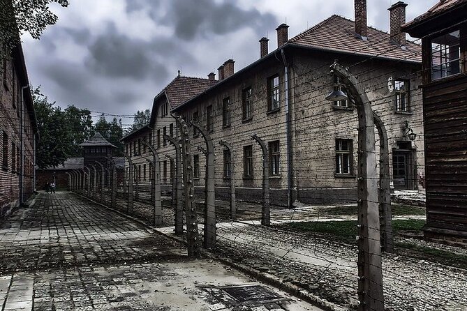 Auschwitz Birkenau Transfer and Guide with Salt Mine Combo Option - Entering Auschwitz I, the former prisoner camp