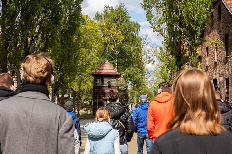 From Krakow: Auschwitz-Birkenau Guided Tour with Transport - Auschwitz I and the Arbeit Macht Frei gate