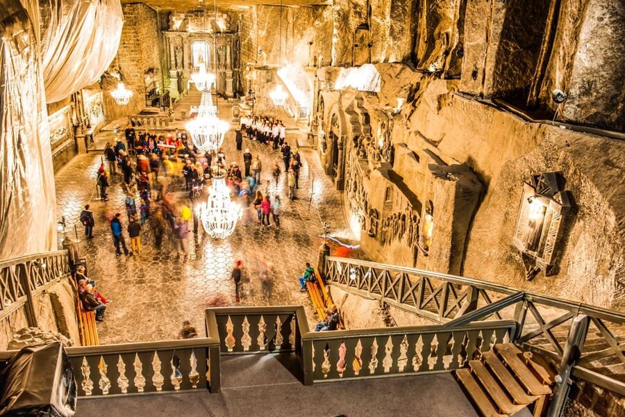 From Krakow: Wieliczka Salt Mine Guided Tour & Pickup Option - Chambers, lakes, and salt-carved stories