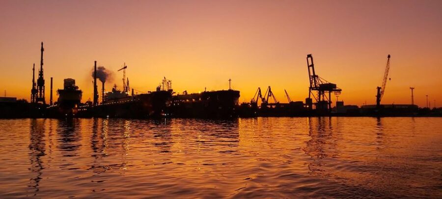 Gdańsk: Scenic Sunset Cruise with Welcome Drink - The modern riverfront and wartime memory