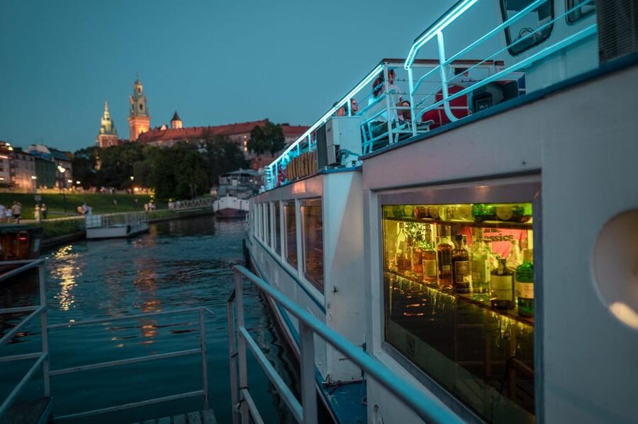 Kraków: Evening or Night River Cruise - Boarding beneath Wawel Castle