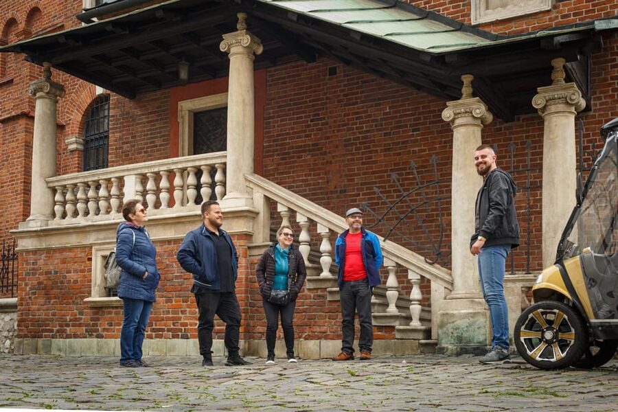 Krakow: Extended City Sightseeing Tour - Eco Buggy Golf Cart - Podgorze brings the tour into harder history