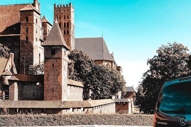 Malbork Castle regular tour - Hearing the guide in cavernous rooms