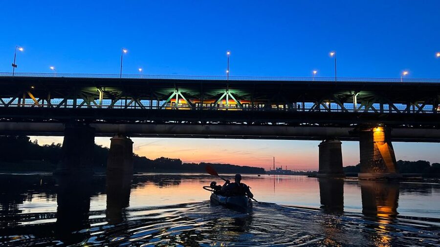 Packrafting kayaking guided tour Vistula river Warsaw Poland - Sunset, Warsaw stories and the view back to the Old Town