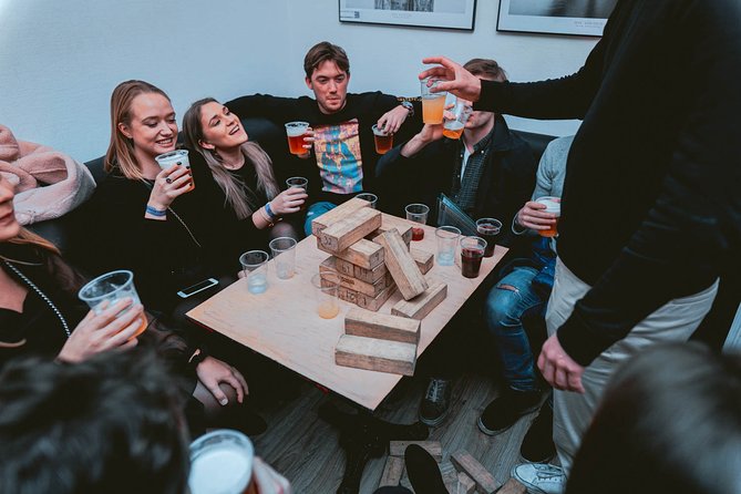 Pub Crawl + Unlimited Drinks + VIP entry + Drinking Games & Photographer - The First Stop: An Open Bar With a Social Purpose